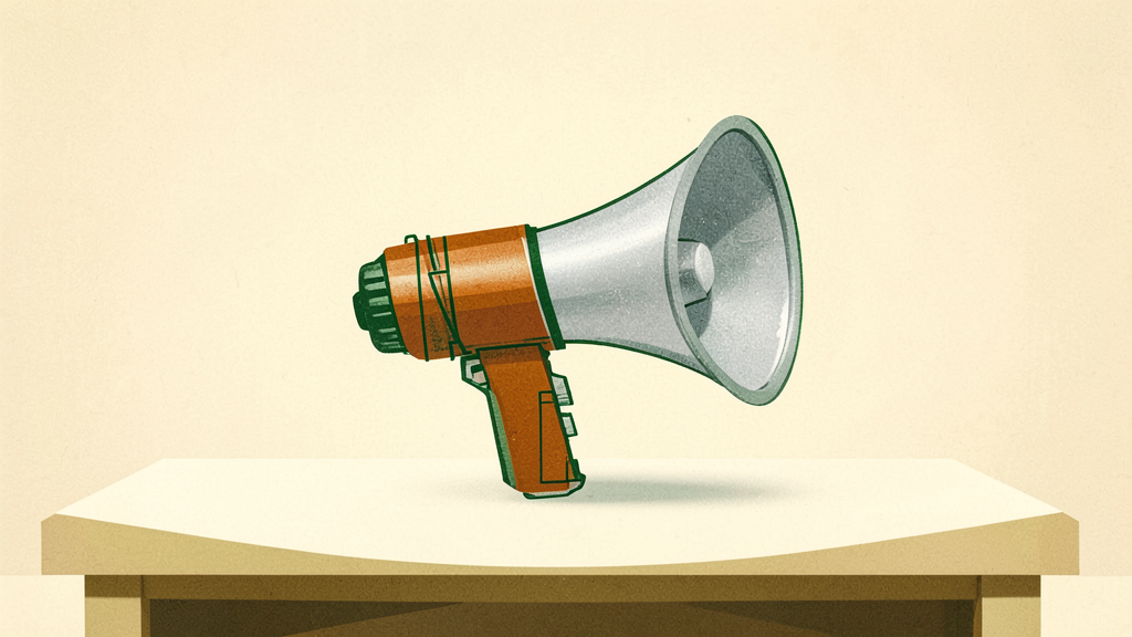 A vintage-style megaphone rests on a minimalist white table against a soft beige backdrop